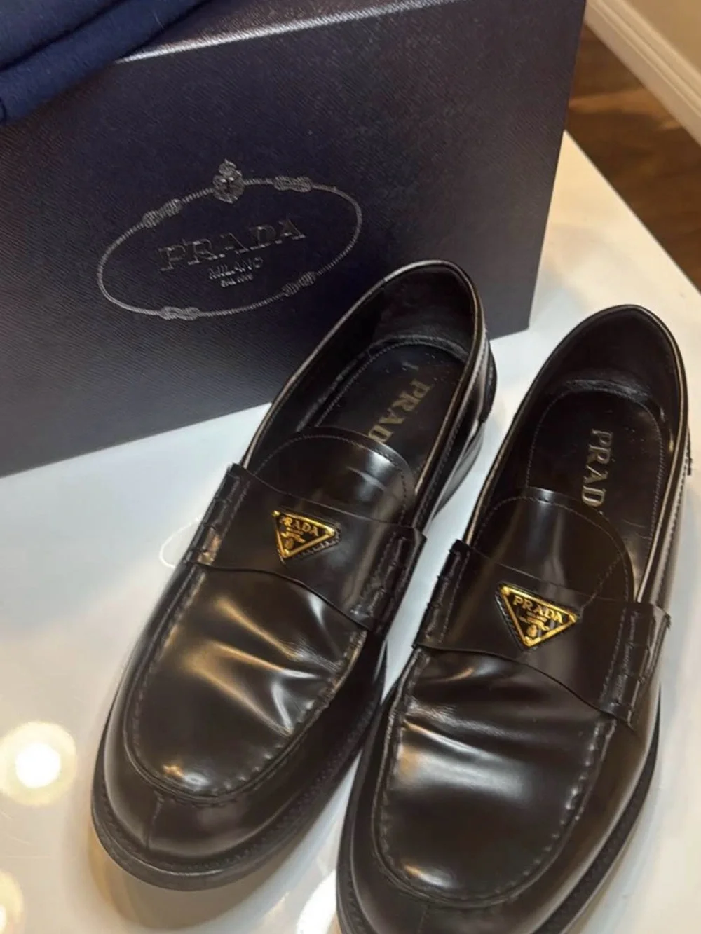 Prada Black Leather Men's Slip-On Loafers with Gold Logo